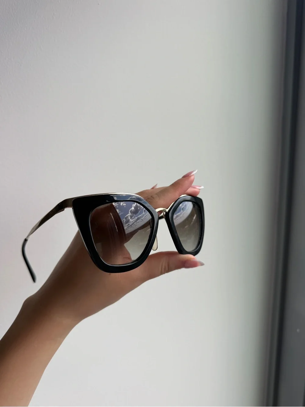 Prada Black Cat-Eye Sunglasses with Gradient Lenses
